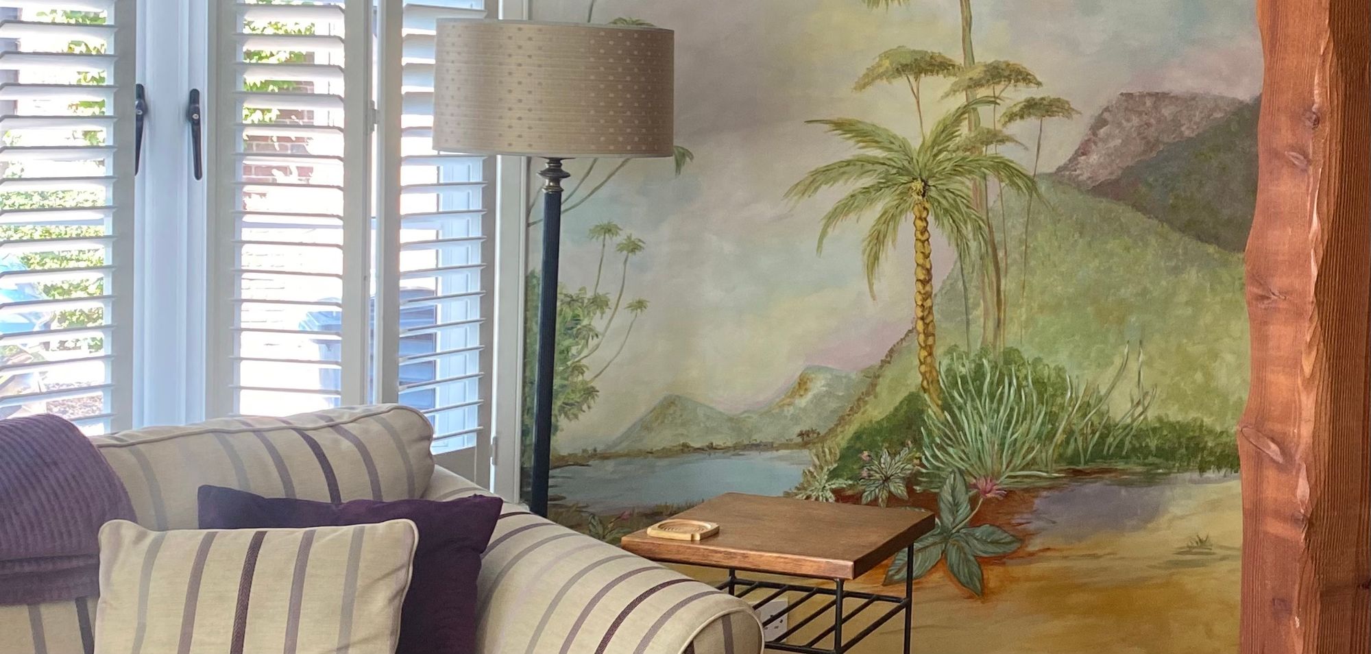A large hand-painted floral mural in a private residence